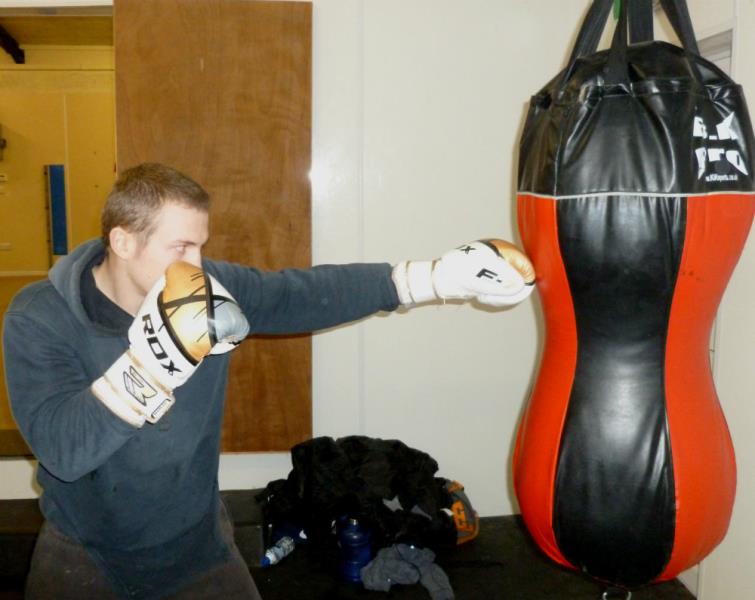 Thomas Bradford using the punch bag
